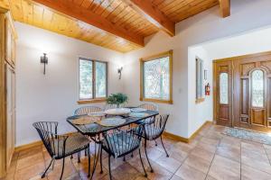 a dining room with a table and chairs at Million Dollar Mountain View in Crestline