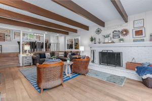 a living room with a couch and a fireplace at Serene Cabin in Lake Arrowhead
