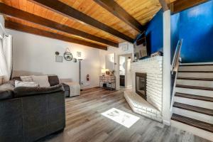a living room with a couch and a fireplace at Blue Bird Beauty in Running Springs