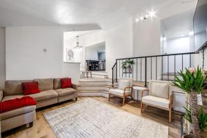 a living room with a couch and two chairs at Red Cottage Charmer in Lake Arrowhead