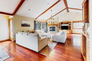 a living room with two couches and a fireplace at Deer Mountain in Lake Arrowhead
