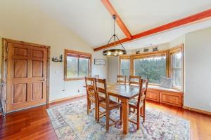a dining room with a wooden table and chairs at Deer Mountain in Lake Arrowhead