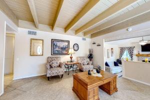 a living room with a table and chairs at Treelands Lodge in Crestline