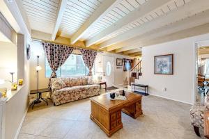 a living room with a couch and a table at Treelands Lodge in Crestline +19 photos