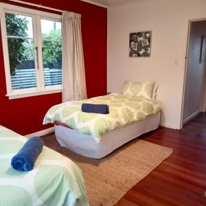 a bedroom with two beds and a window at Dated but Delightful on D'Arcy in Richmond