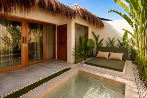 a villa with a swimming pool in front of a house at Villa Xana - Private pool - SOFT OPENING in General Luna