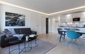 a living room with a couch and a table at Princess in Binz