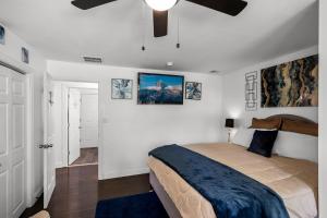 a bedroom with a bed and a ceiling fan at Waterfront Gem in Willingboro