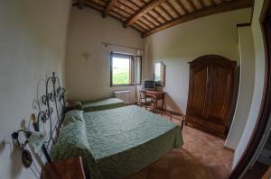 A bed or beds in a room at Villa le Vigne