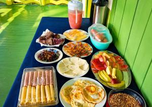 a table topped with lots of different types of food at Amazon Anavilhanas Lodge in Aiparuça +43 photos