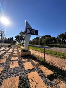 a hotel sign on the side of a road at Verdant hotel in Bonito