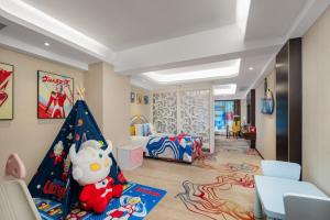 a childs room with a toy tent and a bedroom at ShangHai LuAn Garden Hotel-Complimentary shuttle service between Shanghai Pu d ong Airport and Disneyland in Shanghai +70 photos