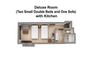 two small double beds and one sofa in a small studio apartment at goom Hotel Nakasu in Fukuoka