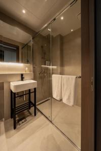 a bathroom with a sink and a shower at My Me Hotel in Seoul +21 photos