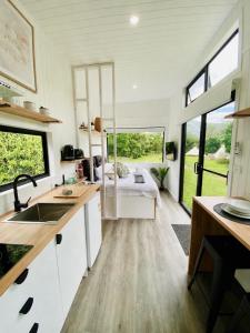 a kitchen with a sink and a bed in a room at SUNRISE at Heartland in Huonbrook