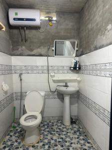 a bathroom with a toilet and a sink at Sapa Local Guide Homestay Trek 2 Days 1 Night or Multi-Day Trekking in Lao Cai