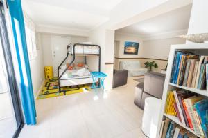 a room with a book shelf and a bed at Amity Escape - Sleeps 14 in Amity Point