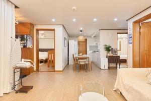 a living room and a kitchen with a dining room at Stay GAON in Seoul