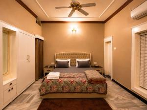 a bedroom with a bed and a ceiling fan at Casa37 in Jaipur