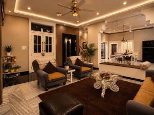 a living room with couches and a table at Casa37 in Jaipur