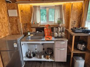 a small kitchen with a sink and a stove at Cheongdo Apa Camp in Cheongdo +18 photos