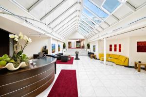 a large living room with a glass ceiling at Wolfsburg Sandkamp Hotel by Belvilla in Wolfsburg