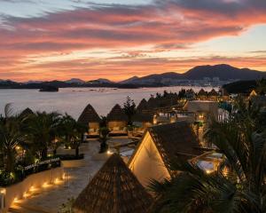 a view of a resort with a sunset at Latterace Resort in Yeosu +134 photos