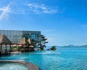a view of a resort with a swimming pool at Latterace Resort in Yeosu