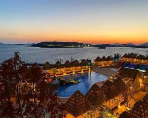 an aerial view of a resort with a large body of water at Latterace Resort in Yeosu