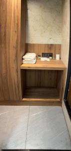 a wooden shelf with a sink in a room at Hotel RK Gharana Inn in Siwān