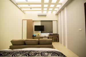 Телевизор и/или развлекательный центр в Ai Lian Shan Shui Homestay
