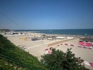 a view of a beach with the ocean in the background at Golden Rose Residence in Constanţa