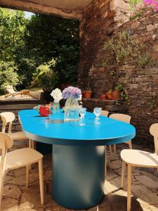 a blue table and chairs on a patio at Casa Malde in Cedeira
