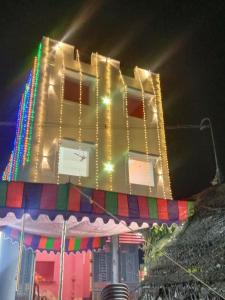 a building with lights on it at night at Dharani Residency in Pondicherry