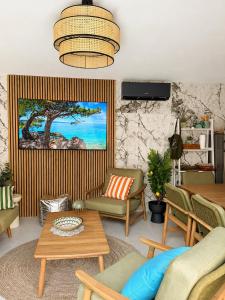 a living room with a couch and a table at Villa Vida, Medulin - Bazen i jacuzzi in Medulin