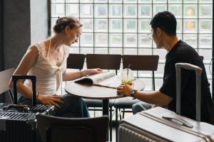 a man and a woman sitting at a table at YAMATO - Doyanen Hotels in Osaka