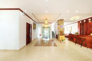 a hallway of a building with a chandelier at Maro Boutique Villa in Da Lat