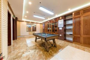 a room with a pool table in it at Maro Boutique Villa in Da Lat