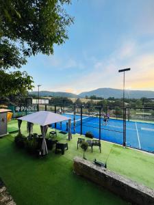 a view of a swimming pool with a table and chairs at Dimora Gubbiano in Cascia
