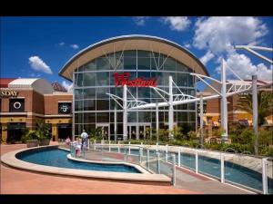 a large building with a swimming pool in front of it at Bienes House in Brandon