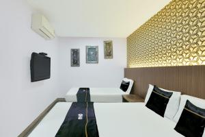 a hotel room with two beds and a tv at Dancenter Hotel Shah Alam in Shah Alam +38 photos