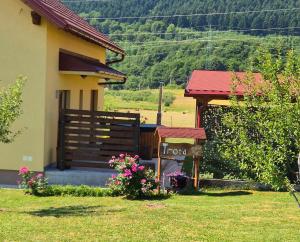 a house with a sign in front of it at Kuća Trota - sauna, HOT TUB in Otočac