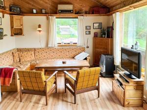 a living room with a table and a couch at 8 person holiday home in Jelsa-By Traum in Jelsa