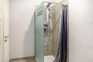 a shower with a glass door in a bathroom at Auszeit Helsa in Helsa +13 photos