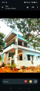 a screenshot of a house with a picture of it at Keshu Home Stay Hampi in Hospet +19 photos