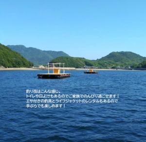 two boats on a large body of water at Hatoya in Mitoyo