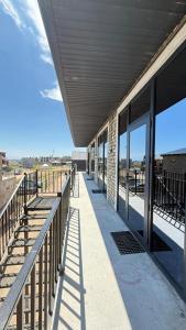 a building with a row of windows on the side at aROYAL in Cholpon-Ata +14 photos