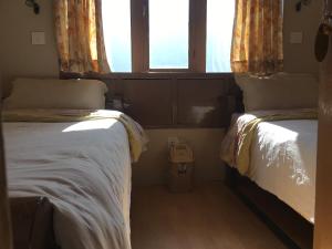 Postelja oz. postelje v sobi nastanitve Hotel Khangri