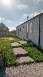 a walkway next to a building next to a building at Alloro-dog in Hem +10 photos