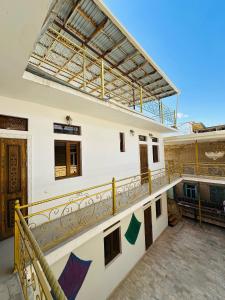 a view of a building with a balcony at Mashhur in Bukhara
